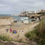 ...� celata �cala Verdegiglio�, una spiaggia sabbiosa incorniciata da grandi massi